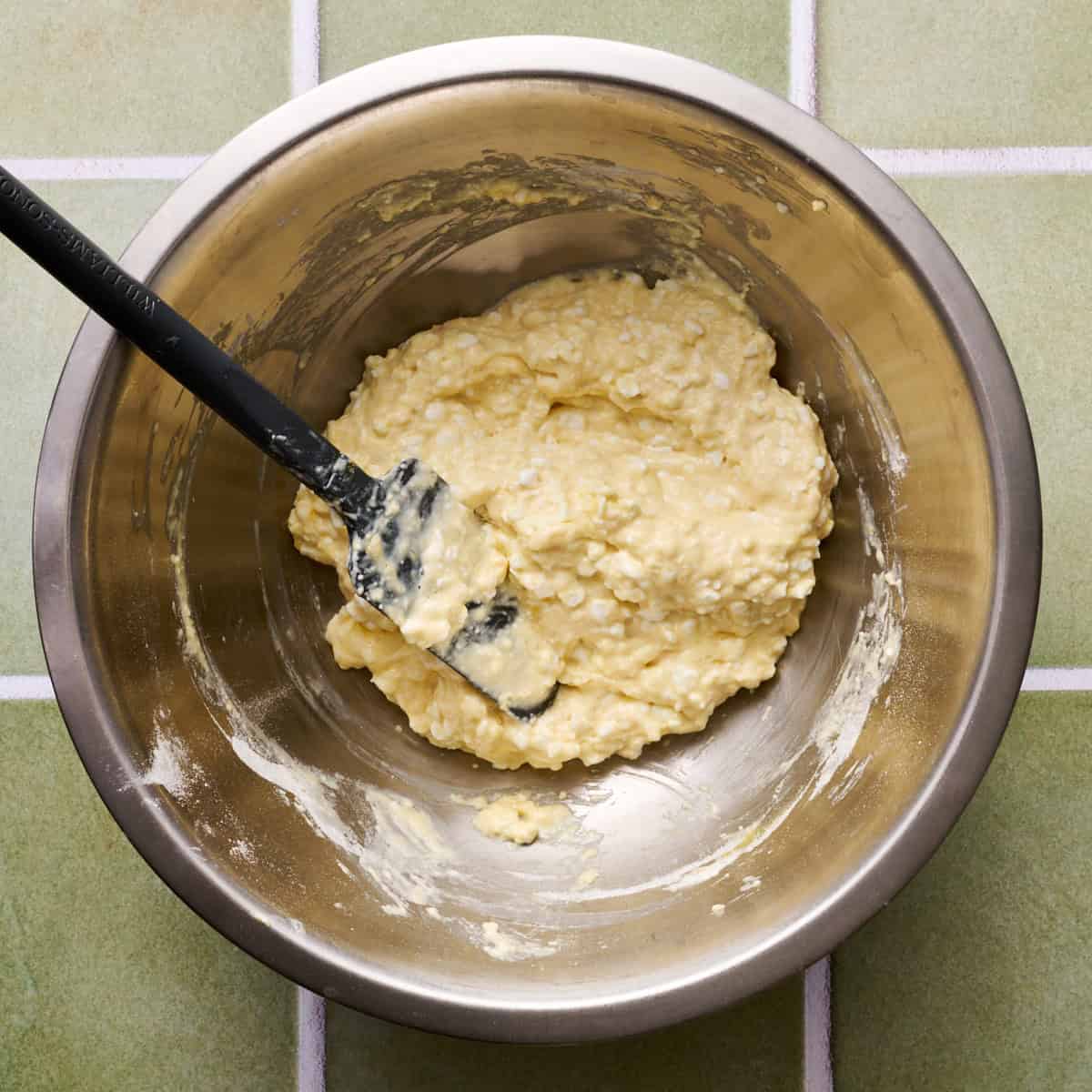 a metal bowl with the crust batter mixed together