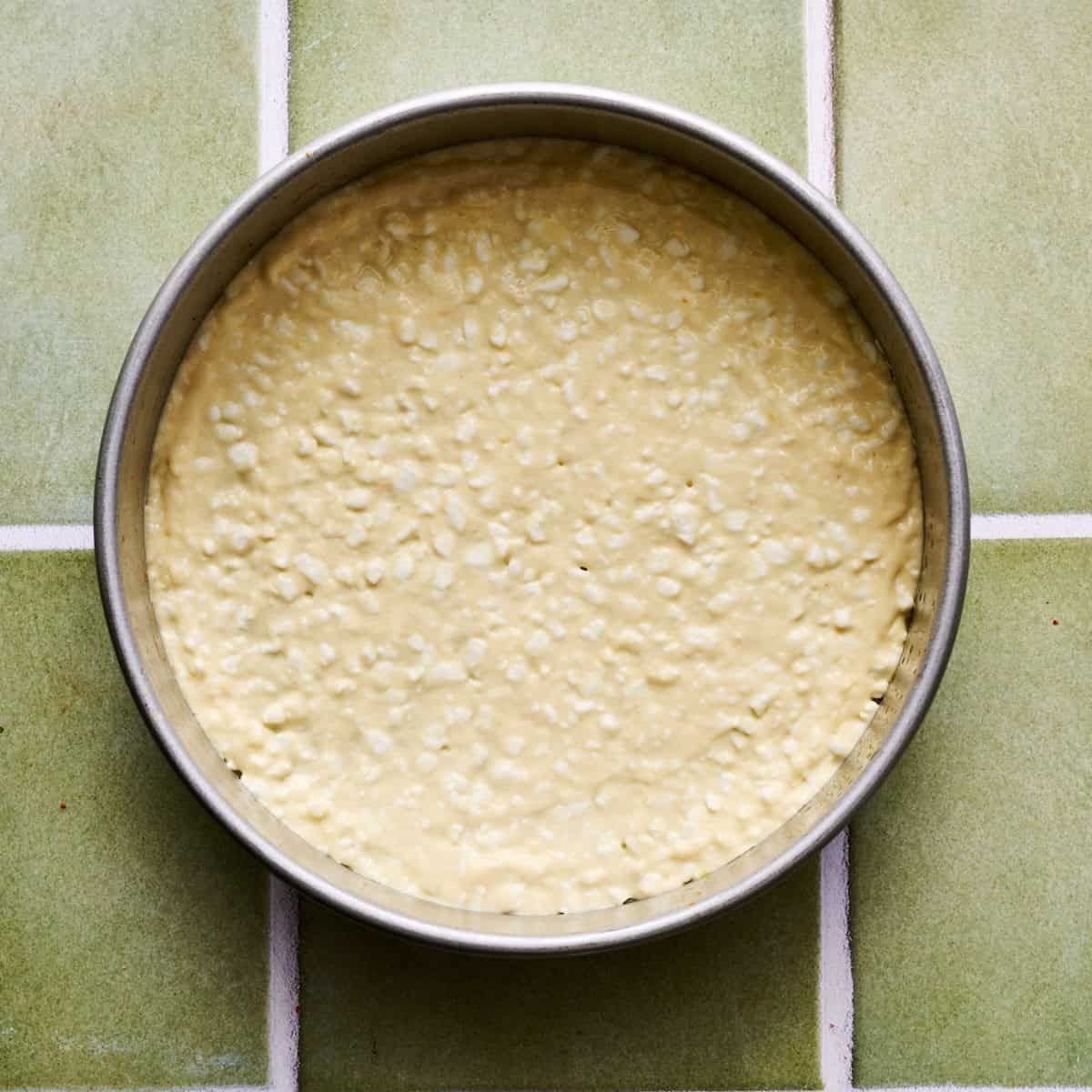 the crust batter spread thin in a 9 inch cake pan