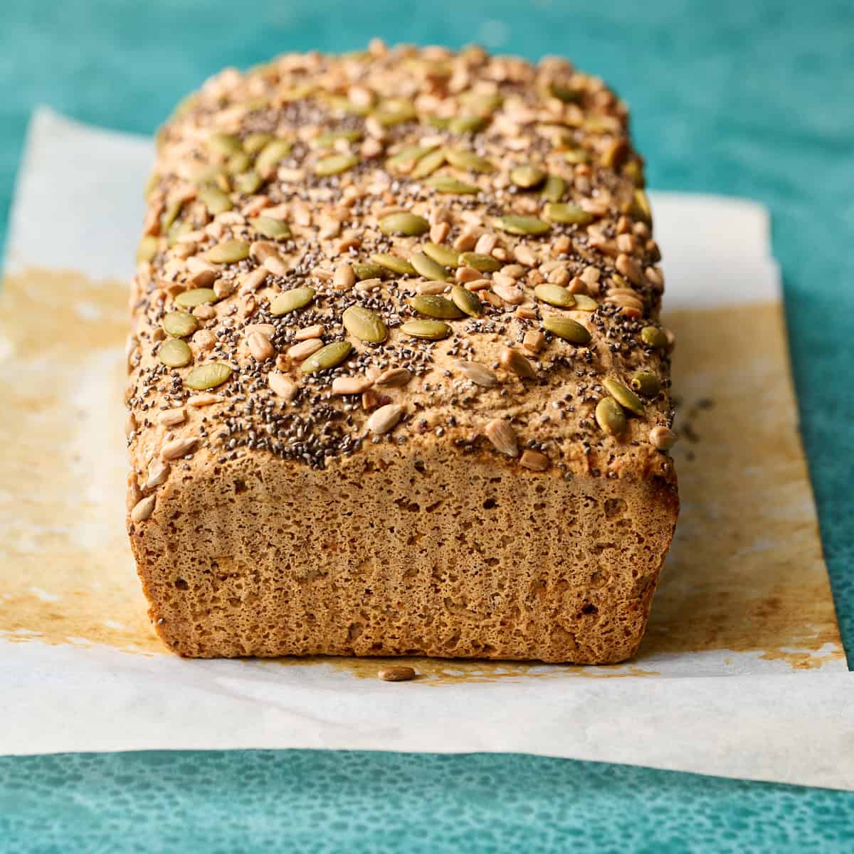 Bread on a piece of parchment on a green background