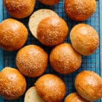 overhead of hamburger buns on a cooling rack