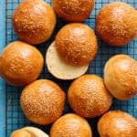 overhead of hamburger buns on a cooling rack