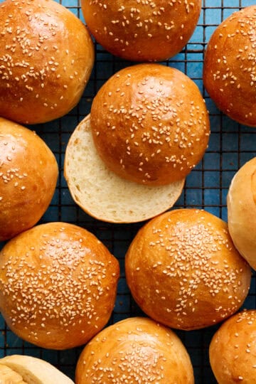 overhead of hamburger buns on a cooling rack
