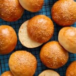 overhead of hamburger buns on a cooling rack