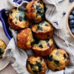 Cottage Cheese Blueberry Muffins stacked in a blue serving dish
