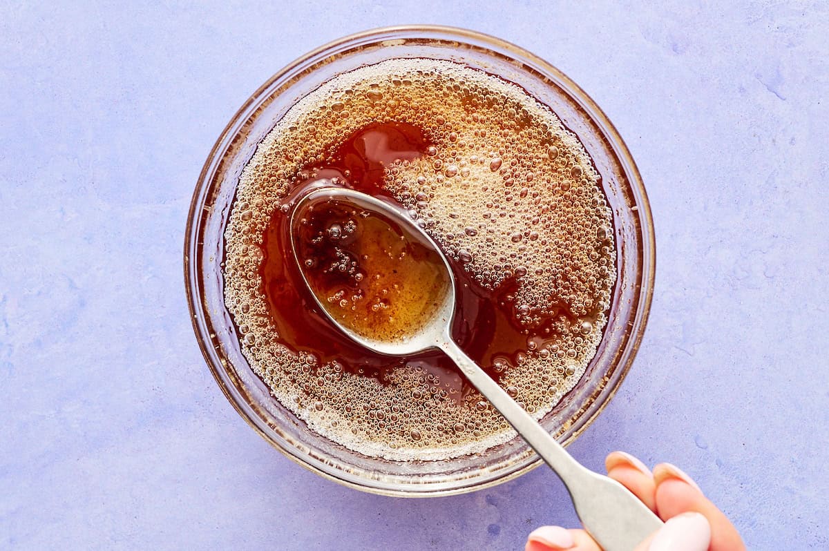 browned butter in a glass bowl with a spoon