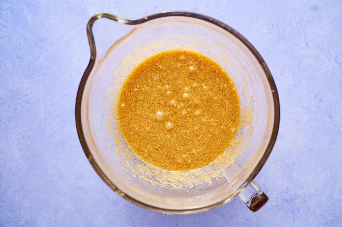 eggs and vanilla added to the browned butter sugar mixture in a mixing bowl