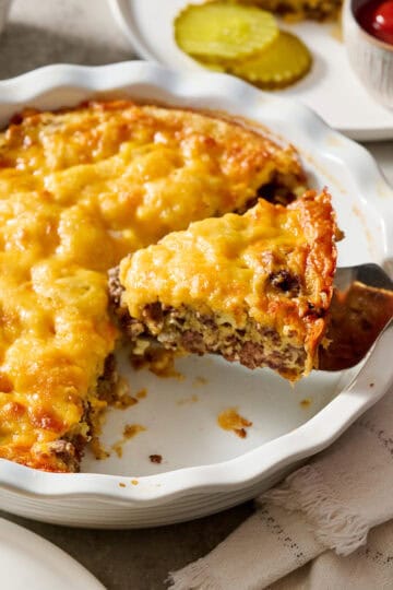 Cheeseburger Pie being served on white plates