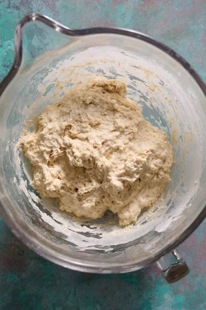 shaggy dough in a mixing bowl after initial mixing before stretch and folds