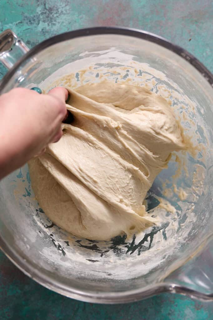 completing stretch and folds with the mixed dough to build gluten bonds and structure for the sourdough loaf