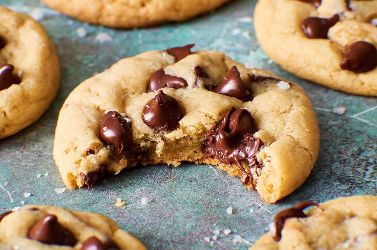 sourdough discard cookie with a bite taken out to show gooey chocolate and soft interior