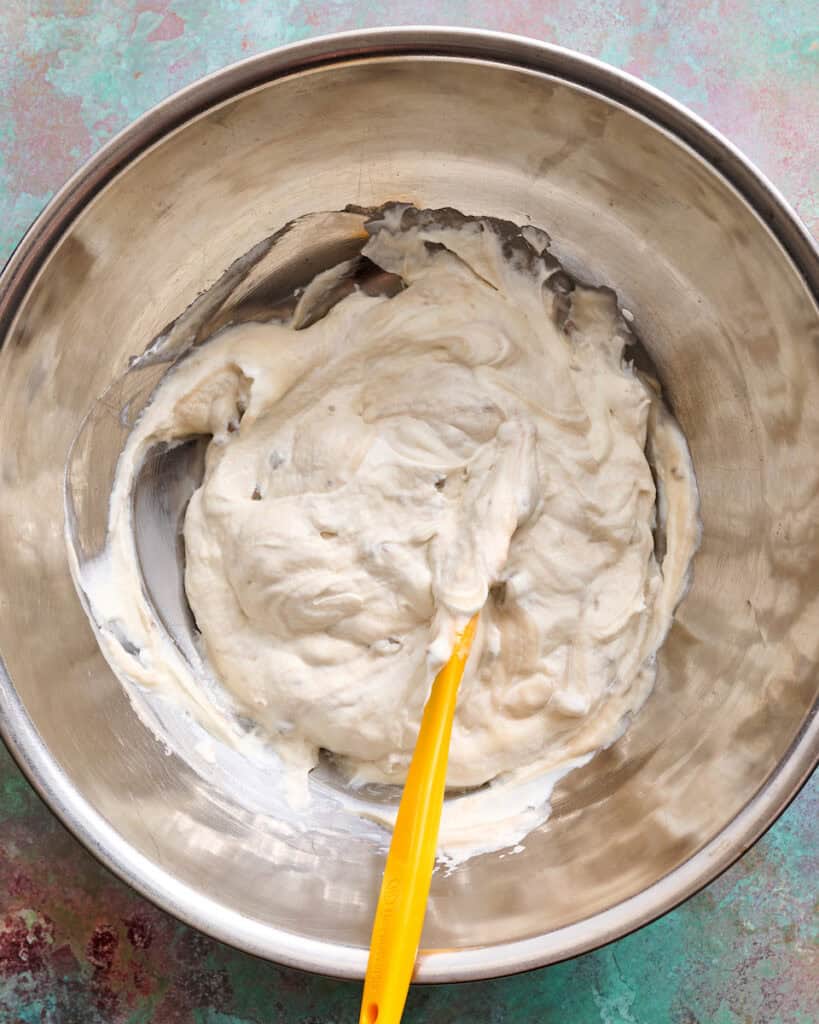 mixing sour cream and cream of mushroom soup together
