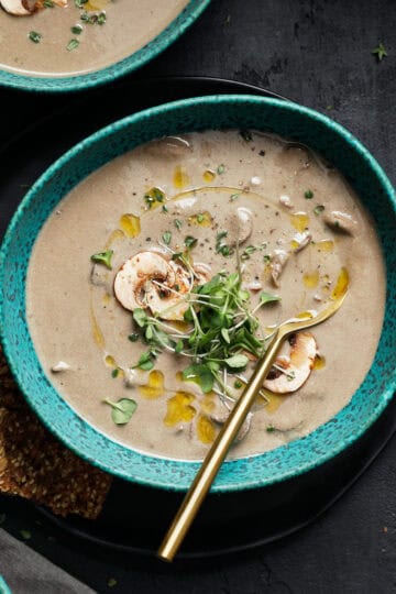 bowl of dairy free cream of mushroom soup in a green bowl