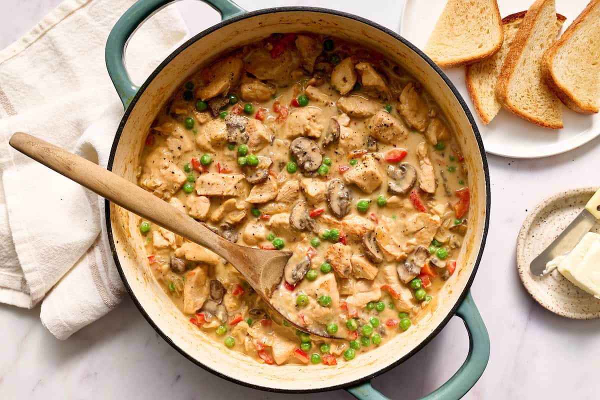 pot of chicken a la king with toast on the side