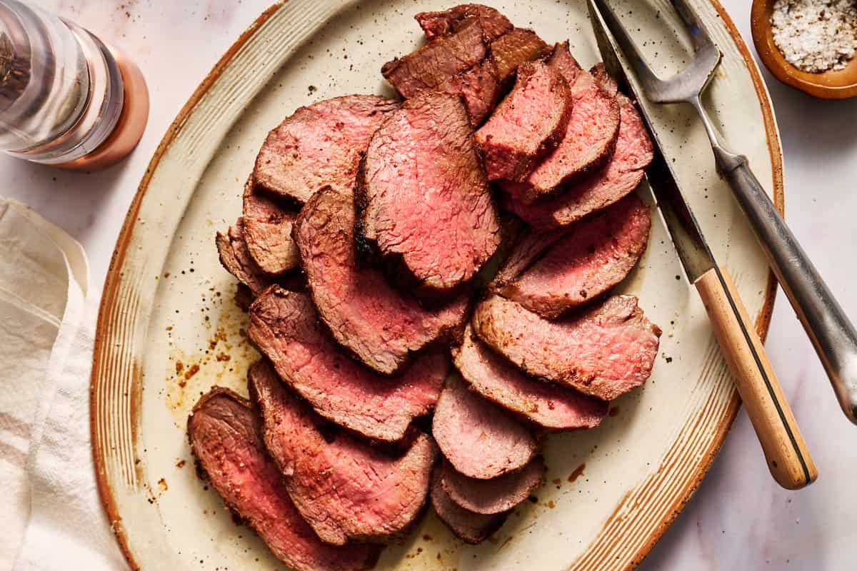 tri tip roast sliced on a serving platter