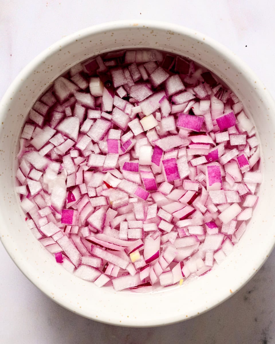 red onion soaking in water