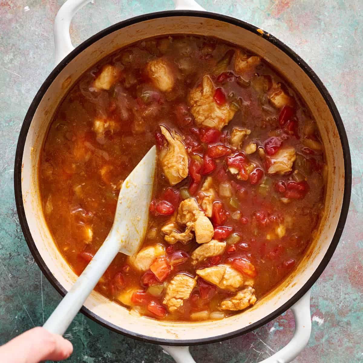adding the liquid ingredients to the pot