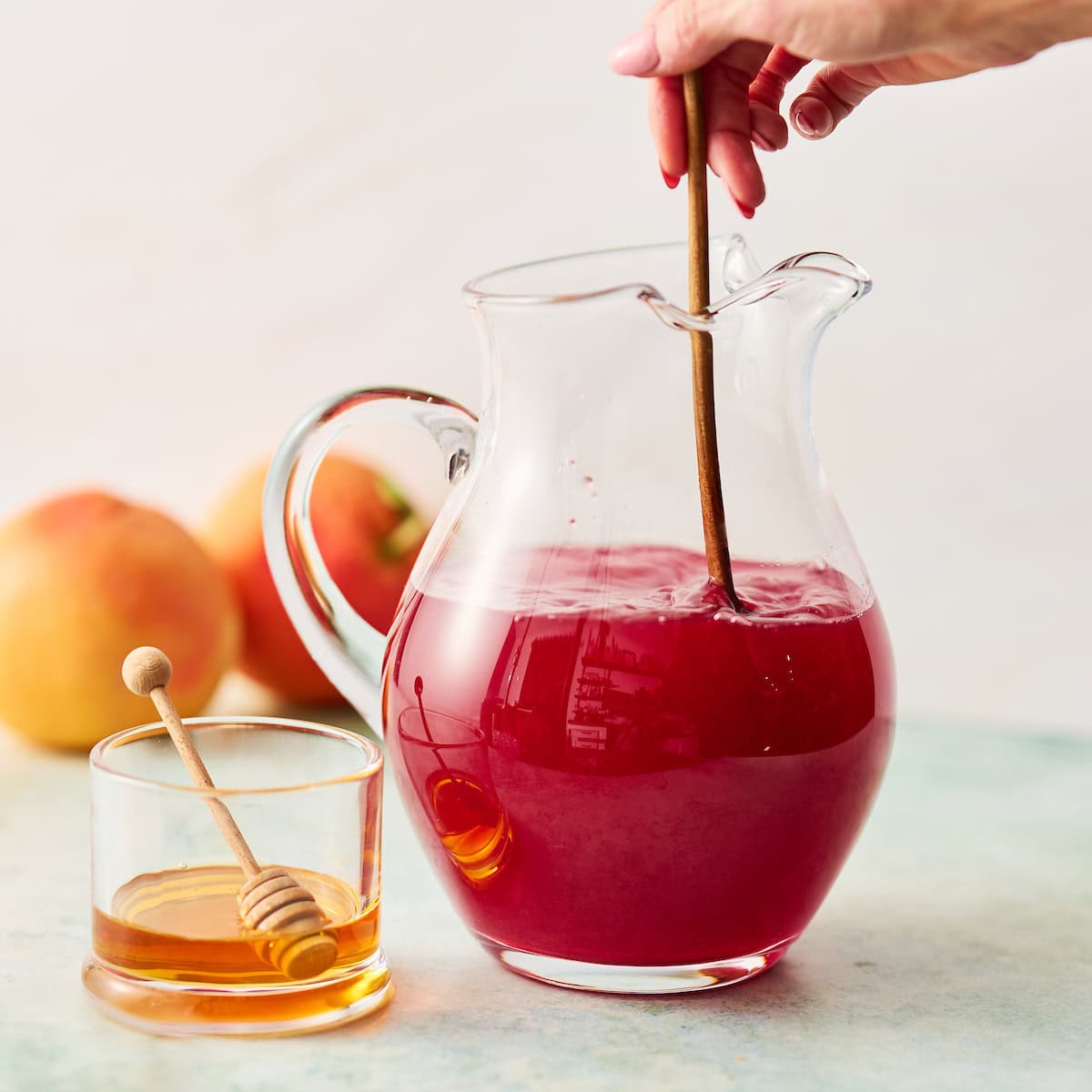 stirring honey into tea mixture