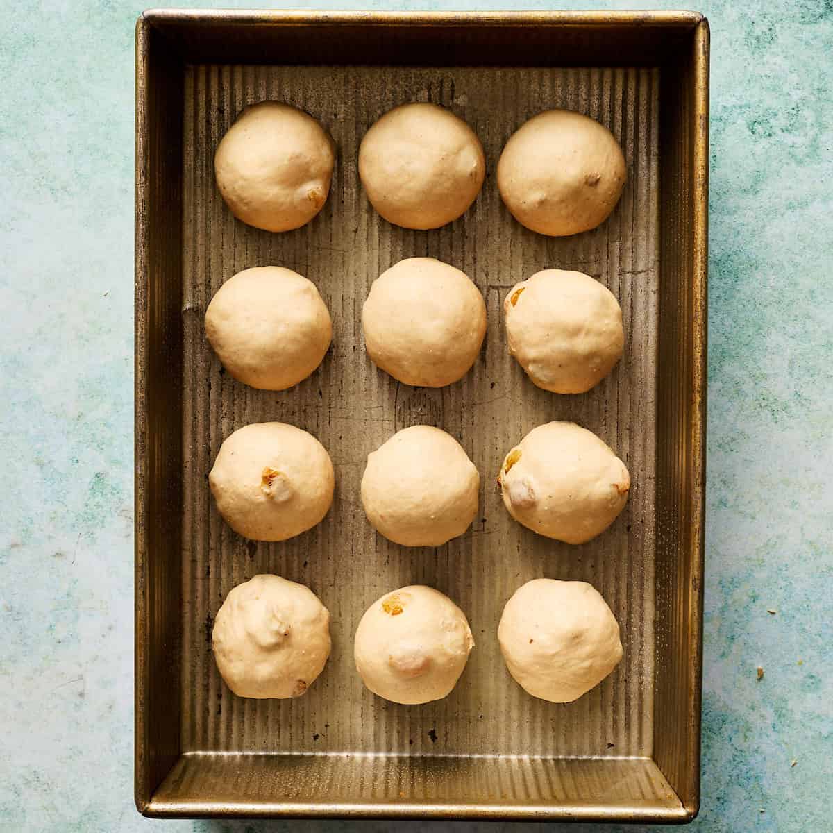 rolls before second rise in a 9 x 13 inch baking pan